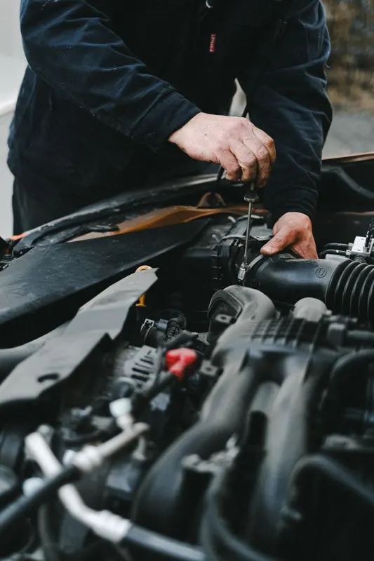 Mechanic working on a car engine
